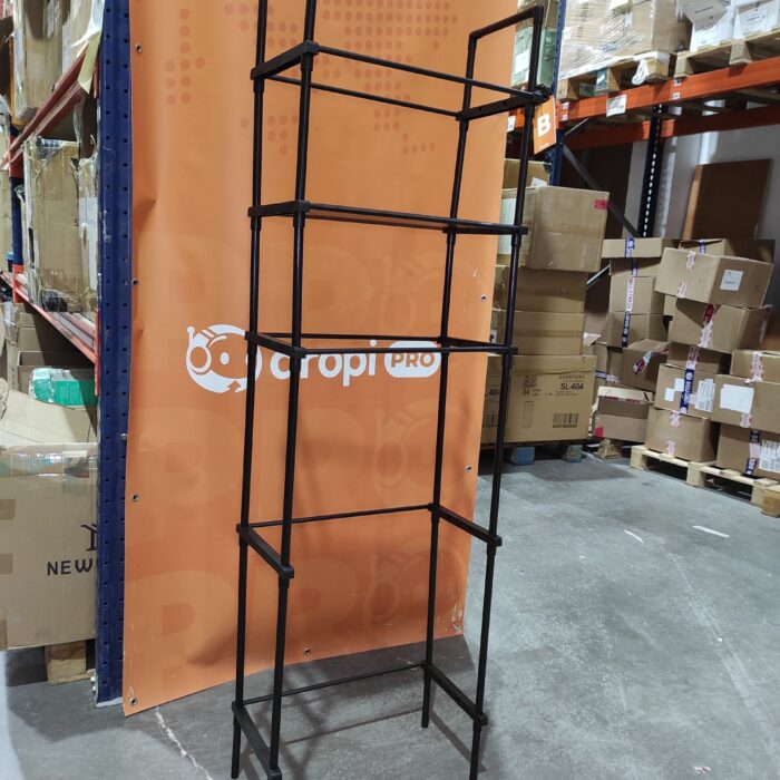 Estanteria de almacenamiento de metal sobre el inodoro