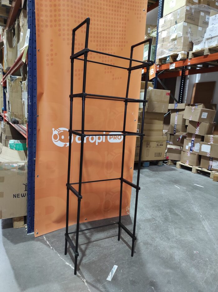 Estanteria de almacenamiento de metal sobre el inodoro